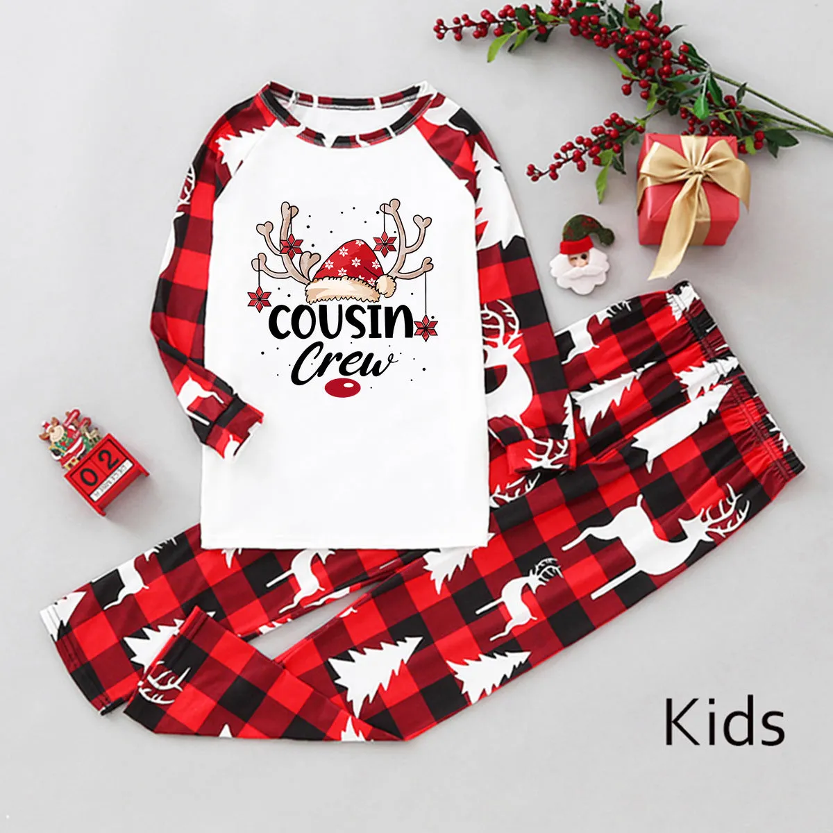 Cousin Crew Christmas pajama set with reindeer print